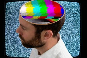 Seeing Sound with Your Ears man with test pattern fir a brain on a tv screen